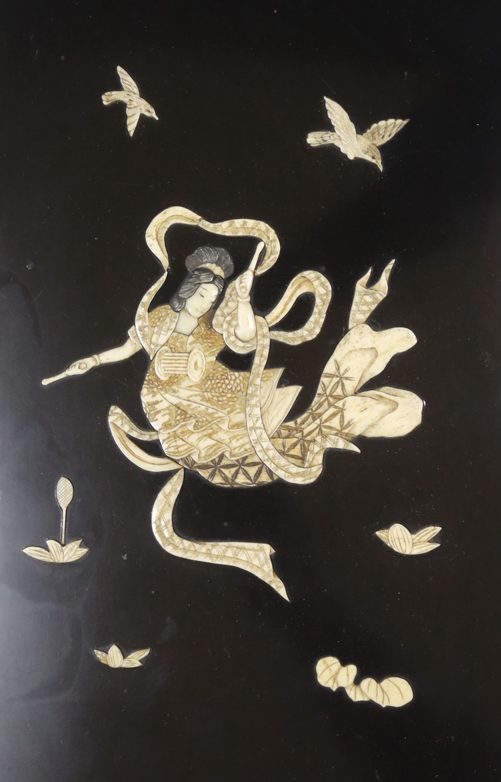 A Japanese ivory and bone inlaid lacquer panel of an immortal, late 19th century, 30x20cm